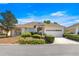 Charming single-story home with manicured landscaping and attached two car garage at 9882 Sw 89Th Lane Rd, Ocala, FL 34481