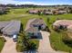 Beautiful home featuring lush landscaping and a well-manicured lawn in a golf community at 12333 Se 177Th Loop, Summerfield, FL 34491