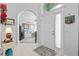 Welcoming foyer features tile flooring, an archway, and decorative accents, creating a grand entrance at 12333 Se 177Th Loop, Summerfield, FL 34491