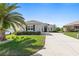 Well-manicured house with an inviting driveway and attractive landscaping at 12333 Se 177Th Loop, Summerfield, FL 34491