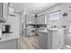 Efficient kitchen equipped with appliances, countertops, cabinetry, and ample natural light at 12333 Se 177Th Loop, Summerfield, FL 34491