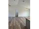 A bright and airy living room features soaring ceilings, hardwood floors, and modern light fixtures at 3 Dogwood Trl, Ocala, FL 34472