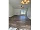 A spacious living room featuring neutral walls, luxury vinyl plank flooring and a ceiling fan at 3 Dogwood Trl, Ocala, FL 34472