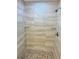 A modern walk-in shower featuring tiled walls and a mosaic tile floor at 3 Dogwood Trl, Ocala, FL 34472