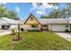 Lovely single-story home with a quaint porch, featuring lush landscaping and an A-frame roof at 9357 Sw 82Nd Ter # B, Ocala, FL 34481