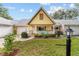 Charming single-story home featuring a cute front porch with an A-frame roof and lovely landscaping at 9357 Sw 82Nd Ter # B, Ocala, FL 34481