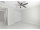 Bright bedroom with ceiling fan and marble-look tile floor at 3339 Se 141St Pl, Summerfield, FL 34491