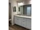 Bathroom featuring double vanity sinks and granite countertops at 6272 Sw 155 Street Rd, Ocala, FL 34473