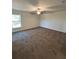 Spacious bedroom with natural light and carpet flooring at 6272 Sw 155 Street Rd, Ocala, FL 34473