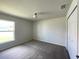 Bedroom features carpet flooring, closet and window at 6272 Sw 155 Street Rd, Ocala, FL 34473