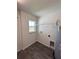 Practical laundry room with storage shelf and hookups at 6272 Sw 155 Street Rd, Ocala, FL 34473