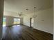 Spacious living room with ample natural light and sleek flooring at 6272 Sw 155 Street Rd, Ocala, FL 34473