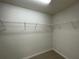 Walk-in closet features white wire shelving at 6272 Sw 155 Street Rd, Ocala, FL 34473