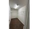 Spacious walk-in closet with shelving and neutral carpeting provides ample storage space at 6272 Sw 155 Street Rd, Ocala, FL 34473