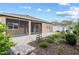 A backyard with a paved patio and a landscaped garden at 7709 Sw 86Th Ct, Ocala, FL 34481