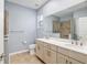 Bathroom featuring a double vanity, framed mirrors, and walk-in shower at 7709 Sw 86Th Ct, Ocala, FL 34481