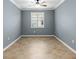 Neutral bedroom featuring tile flooring, a window, and ceiling fan at 7709 Sw 86Th Ct, Ocala, FL 34481