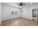 Bright bedroom with tile floor, ceiling fan, and a window at 7709 Sw 86Th Ct, Ocala, FL 34481