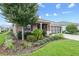 Charming single story home with manicured lawn and colorful, mature landscaping at 7709 Sw 86Th Ct, Ocala, FL 34481
