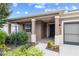 Covered porch with columns, stylish landscaping and a charming, single-story home at 7709 Sw 86Th Ct, Ocala, FL 34481