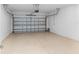 Empty two-car garage features sealed floors and an automatic door at 7709 Sw 86Th Ct, Ocala, FL 34481