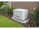 A Generac home generator surrounded by low shrubs and green lawn at 7709 Sw 86Th Ct, Ocala, FL 34481