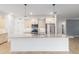 Bright kitchen featuring a granite island, stainless steel appliances, and pendant lighting at 7709 Sw 86Th Ct, Ocala, FL 34481
