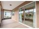 View of the screened lanai featuring a sliding glass door and connection to the backyard at 7709 Sw 86Th Ct, Ocala, FL 34481