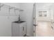Laundry room featuring a utility sink and tile floors at 7709 Sw 86Th Ct, Ocala, FL 34481