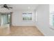 Bright living room featuring tile floors, large windows, and sliding glass doors at 7709 Sw 86Th Ct, Ocala, FL 34481
