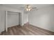 Bedroom with hardwood floors and access to a hallway at 14573 Sw 25Th Ter, Ocala, FL 34473