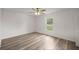 Well-lit bedroom with hardwood floors and a closet at 14573 Sw 25Th Ter, Ocala, FL 34473