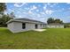 Rear view of the house showcasing a large backyard at 14573 Sw 25Th Ter, Ocala, FL 34473