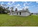 Side view of the house with a spacious backyard at 14573 Sw 25Th Ter, Ocala, FL 34473