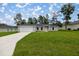 Single-story home with gray siding and a two-car garage at 14573 Sw 25Th Ter, Ocala, FL 34473