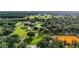 Aerial view of a sprawling estate with lush grounds and equestrian facilities at 22422 Lake Seneca Rd, Eustis, FL 32736