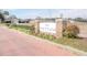 Brick-paved entrance to The Fountains community with a stone sign and landscaping at 4473 Nw 48Th Ln, Ocala, FL 34474