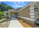 Charming single-Gathering home with a well-manicured lawn and an attached two-car garage at 706 Stanley Ave, Wildwood, FL 34785