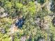 Aerial view of a house nestled in a wooded area at 7131 Sw 19Th Avenue Road Rd, Ocala, FL 34476