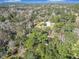 Aerial view of property showing house nestled in lush trees at 7131 Sw 19Th Avenue Road Rd, Ocala, FL 34476