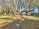 Landscaped backyard with storage shed and seating area at 7131 Sw 19Th Avenue Road Rd, Ocala, FL 34476