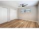 Bedroom with double door closet and ceiling fan at 7131 Sw 19Th Avenue Road Rd, Ocala, FL 34476