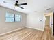 Bright bedroom with wood floors and ceiling fan at 7131 Sw 19Th Avenue Road Rd, Ocala, FL 34476