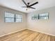 Bright bedroom featuring wood-look floors and ceiling fan at 7131 Sw 19Th Avenue Road Rd, Ocala, FL 34476