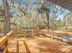 Wooden deck overlooking a scenic wooded landscape at 7131 Sw 19Th Avenue Road Rd, Ocala, FL 34476