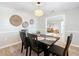 Open dining room with a wooden table and view into the living room at 7131 Sw 19Th Avenue Road Rd, Ocala, FL 34476