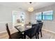 Dining room with a dark wooden table and view into living room at 7131 Sw 19Th Avenue Road Rd, Ocala, FL 34476