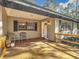 Inviting front porch with tile flooring and wooden deck at 7131 Sw 19Th Avenue Road Rd, Ocala, FL 34476