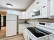 White appliances and granite countertops in kitchen at 7131 Sw 19Th Avenue Road Rd, Ocala, FL 34476