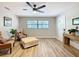 Bright living room with hardwood floors, stylish furniture, and a ceiling fan at 7131 Sw 19Th Avenue Road Rd, Ocala, FL 34476